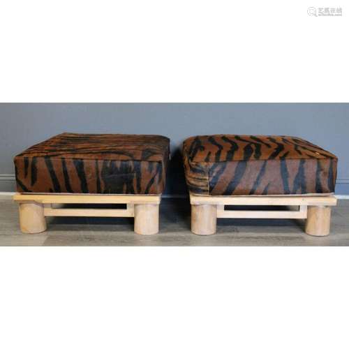 A Pair Of Hide Upholstered Ottomans