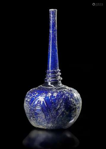 A TALL-NECKED BLUE GLASS BOTTLE, PERSIA OR SYRIA, 11TH-12TH ...