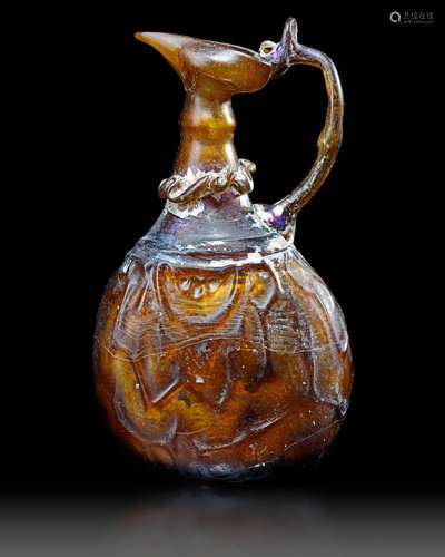 AN AMBER GLASS JUG, PERSIA, 10TH-11TH CENTURY