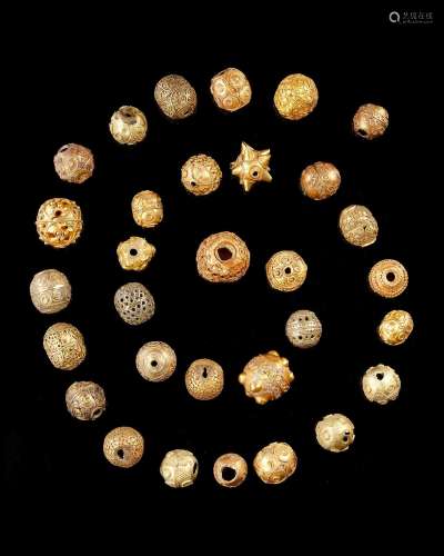 A FATIMID COLLECTION OF ORNATE GOLD BEADS, 11TH-13TH CENTURY