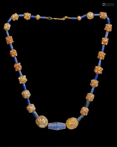 A FATIMID BEADED GOLD NECKLACE, LAPIS-LAZULI, 11TH-13TH CENT...