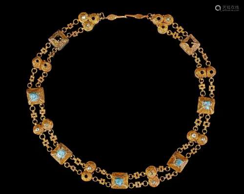 A TURQUOISE AND PEARL-SET PARCEL GOLD BAZUBAND, PERSIA OR AN...