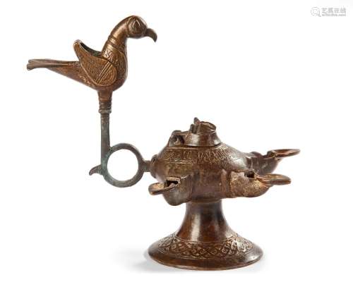AN UMAYYAD INSCRIBED BRONZE OIL LAMP, POSSIBLY ANDALUSIA, 12...