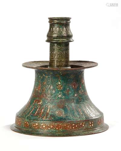 A SILVER-INLAID CANDLESTICK, PERSIA,11TH-12TH CENTURY