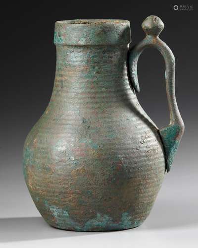 AN UMAYYAD BRONZE EWER, MESOPOTAMIA, 8TH-9TH CENTURY