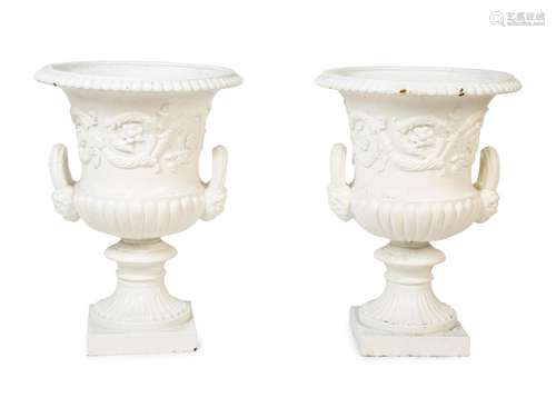 A Pair of Continental Cast Iron Urns Height 25 x diameter 18...