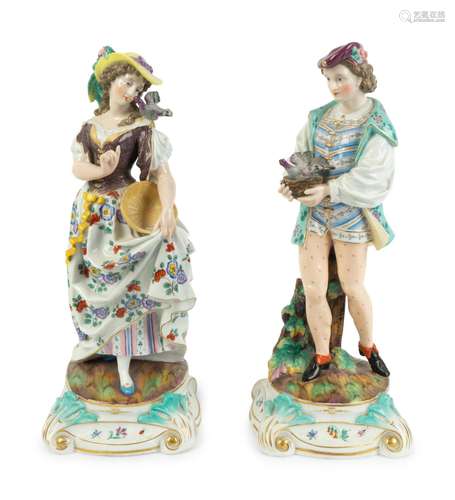 A Pair of Continental Porcelain Figures Height 14 inches.