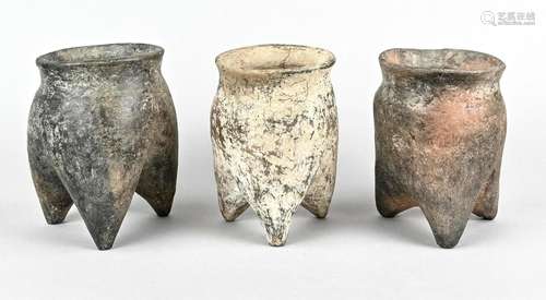 Three hollow-legged storage vessels