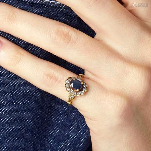 A sapphire, diamond and 18K yellow gold ring. Gross weight: ...