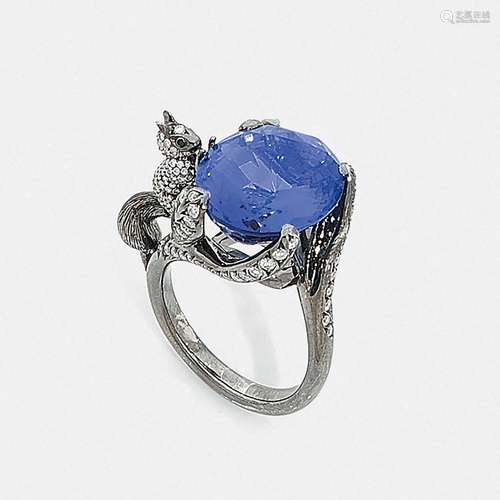 A tanzanite, diamond and gold ring It is set with a large ov...