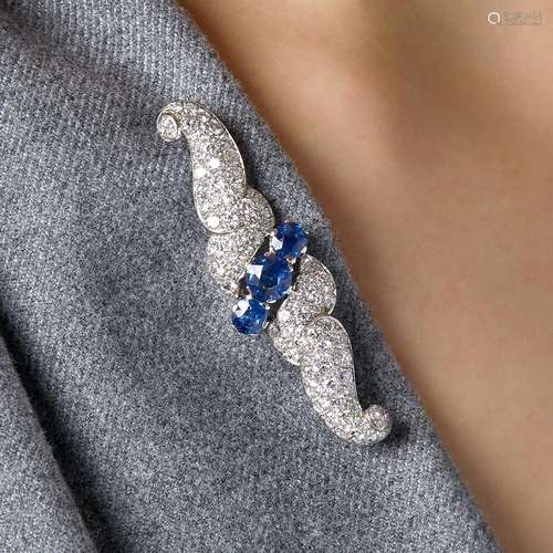 BROCHE VOLUTES SAPHIRS A diamond, sapphire, platinum and 18K...