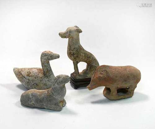 A group of four Chinese pottery animal figures, Han/Tang Dyn...