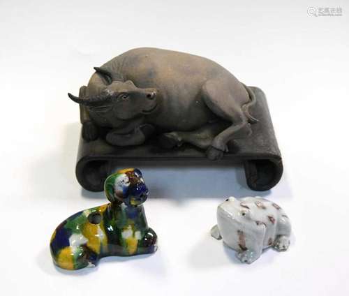 A Chinese Yixing -Style Stoneware figure of a recumbent wate...