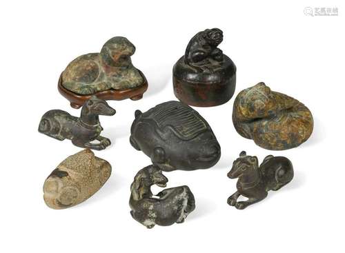 A group of eight Chinese bronze scroll weights,