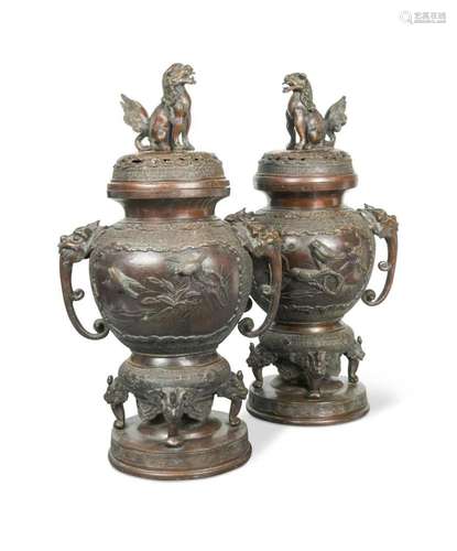 A pair of Japanese bronze vases with covers, late Meiji peri...