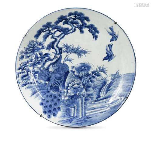 A Japanese blue and white porcelain large peacock charger, l...