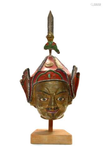 A Tibetan painted stucco head of Padmasambhava, 17th/18th ce...