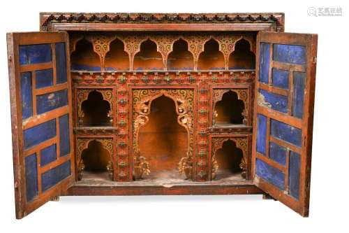 A Tibetan carved and painted private wall shrine, 18th centu...