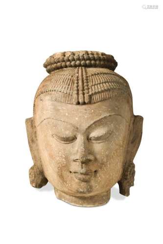 An Indian carved sandstone head of a dancer, early 20th cent...