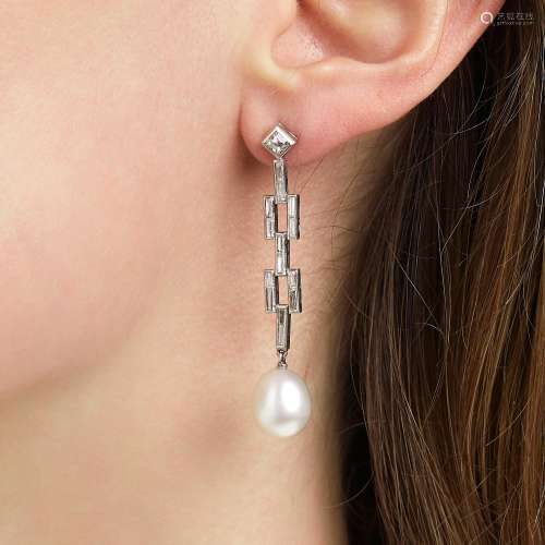 An Art Deco pair of ear pendants set with cultured pearls an...