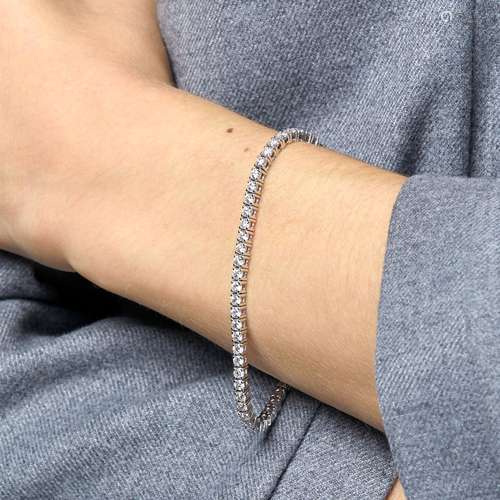 BRACELET LIGNE DIAMANTS A diamond and 18K white gold tennis ...