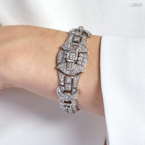 A platinum and 18K white gold bracelet set with old mine cut...