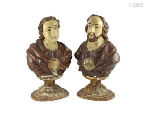 A pair of early 19th century Spanish carved and painted bust...