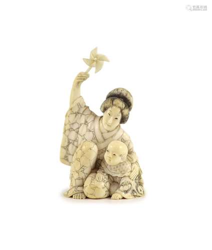 A Japanese ivory okimono of a mother and child, Meiji period...