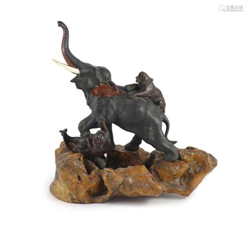 A good Japanese bronze elephant and tiger group, Meiji perio...