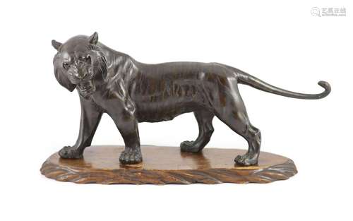 A large Japanese Meiji bronze model of a stalking tiger, Mei...