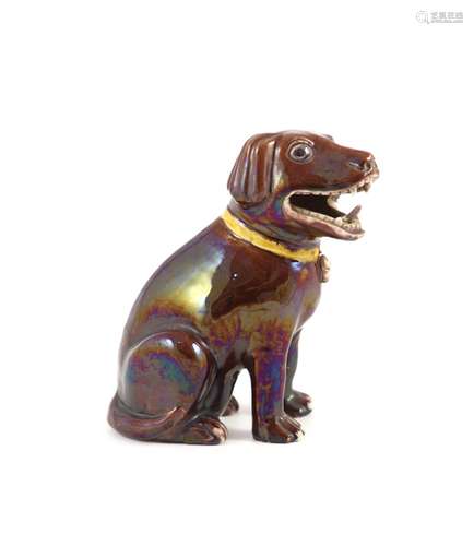 A Chinese brown glazed porcelain model of a seated dog, Qian...