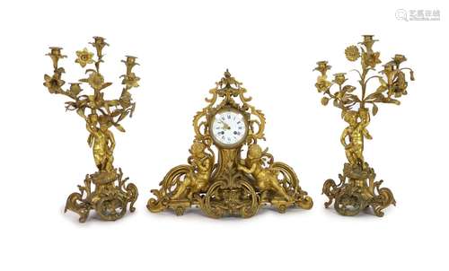 A 19th century Louis XV style ormolu clock garniture, clock ...