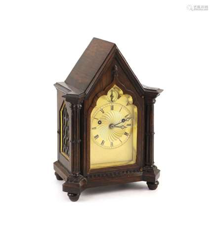 An early Victorian gothic revival rosewood mantle clock, wid...