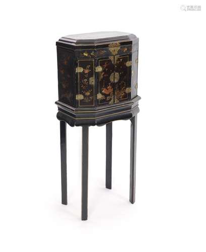 An 18th century Japanese black lacquered table cabinet on st...