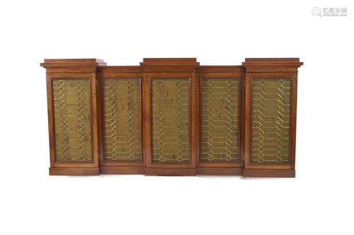 An early Victorian flame mahogany triple breakfront library ...