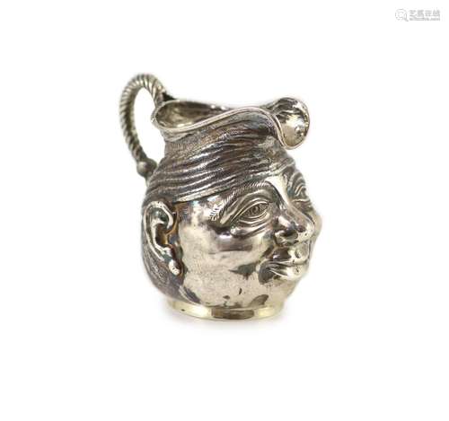 An Edwardian novelty silver cream jug, modelled as a gentlem...