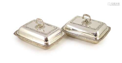 A pair of George III silver entrée dishes and covers, James ...