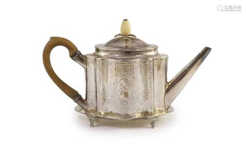 A George III silver bright cut engraved oval teapot and stan...