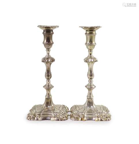 A pair of early George III cast silver candlesticks by Willi...