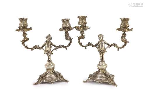 A pair of late Victorian silver two light, two branch candel...