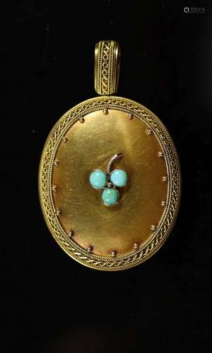 A Victorian gold and three stone turquoise set oval locket