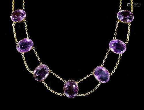 An Edwardian 9ct gold and graduated oval cut amethyst rivier...