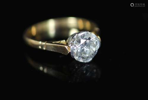 A gold and solitaire diamond ring