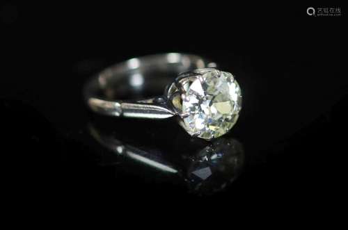 A platinum and solitaire diamond ring