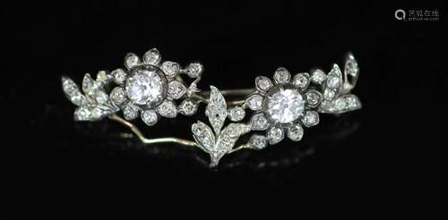 A late Victorian gold, silver and diamond cluster set foliat...