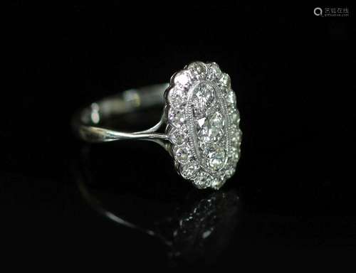 A 1940's 18ct white gold and diamond set oval cluster r...