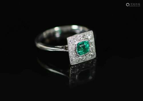 A 1920's platinum, emerald and diamond cluster set tabl...