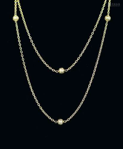 An early 20th century 15ct gold chain link and engraved bead...