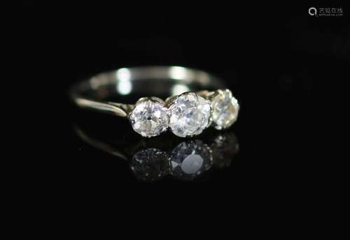 A white gold and three stone diamond set ring