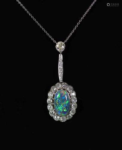 An early 20th century white gold, oval black opal and diamon...